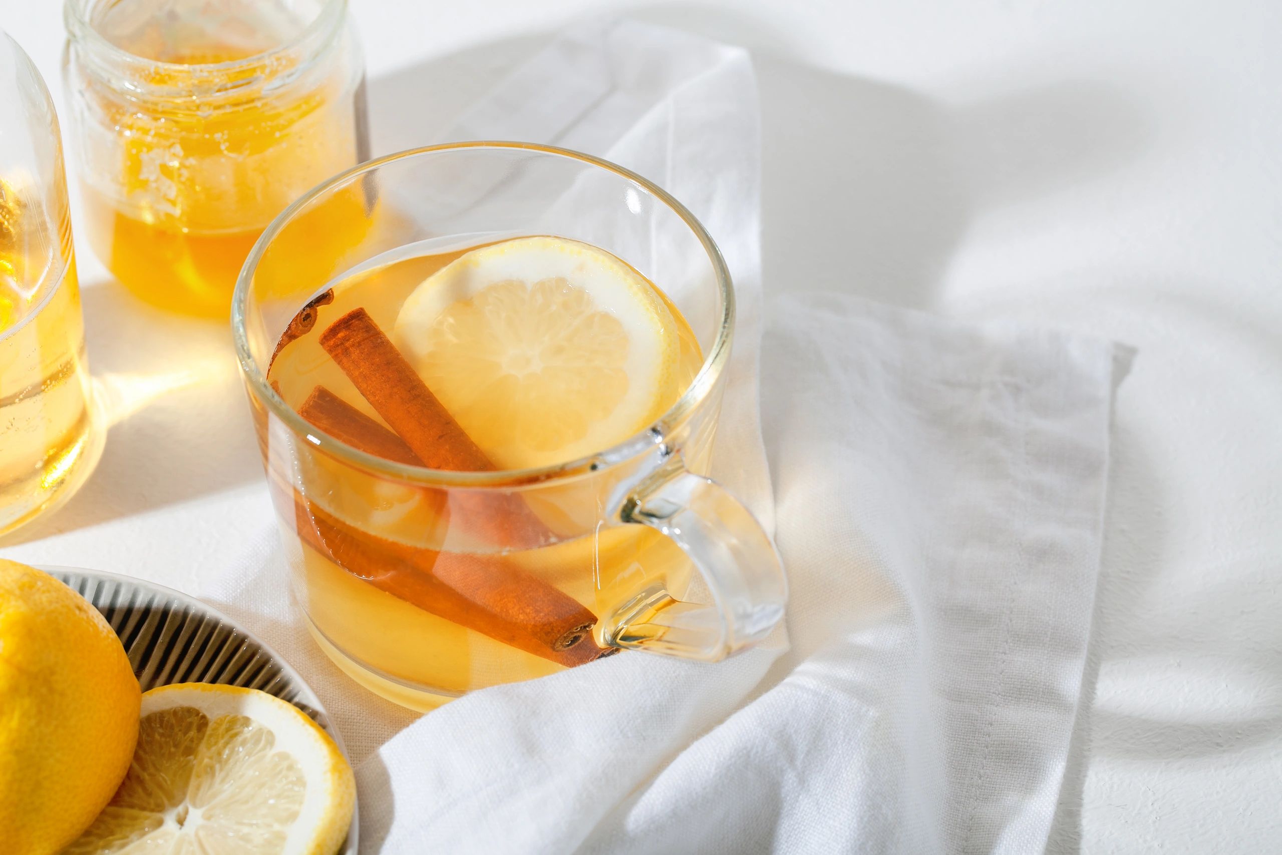 Hot toddy cocktails with lemon and cinnamon