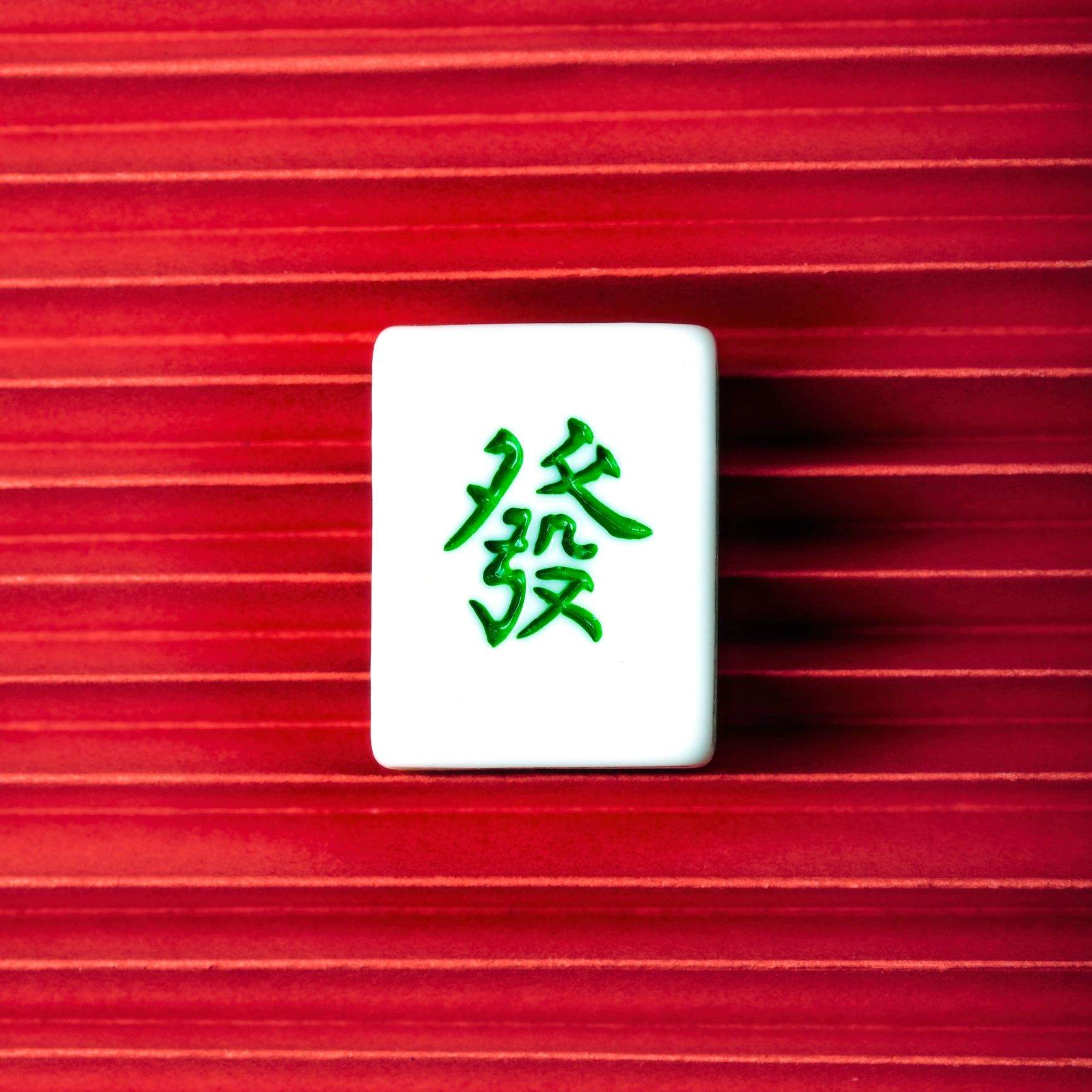 Red mahjong tiles arranged for a festive game