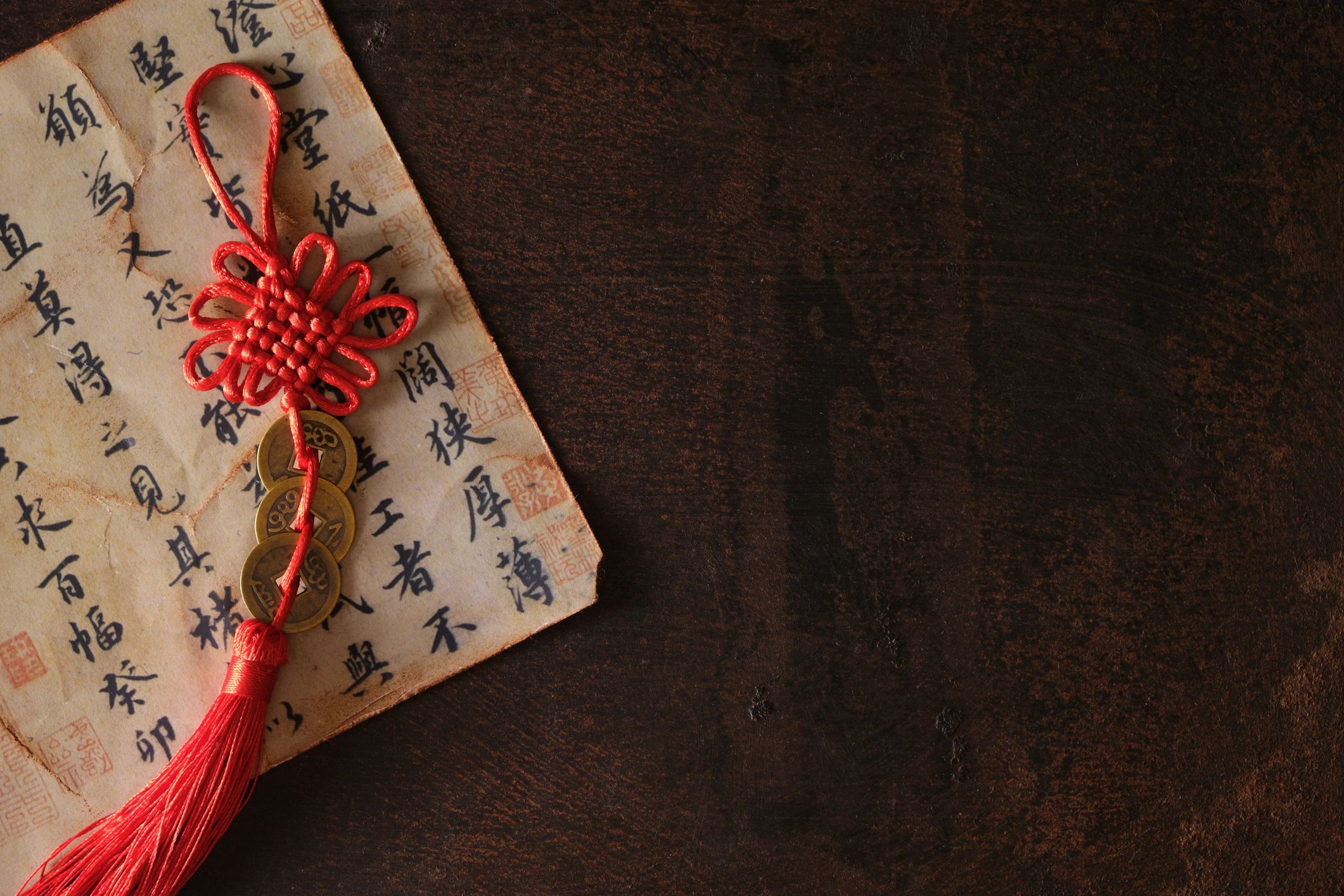 Red and gold good-luck coins arranged as a meaningful tabletop detail