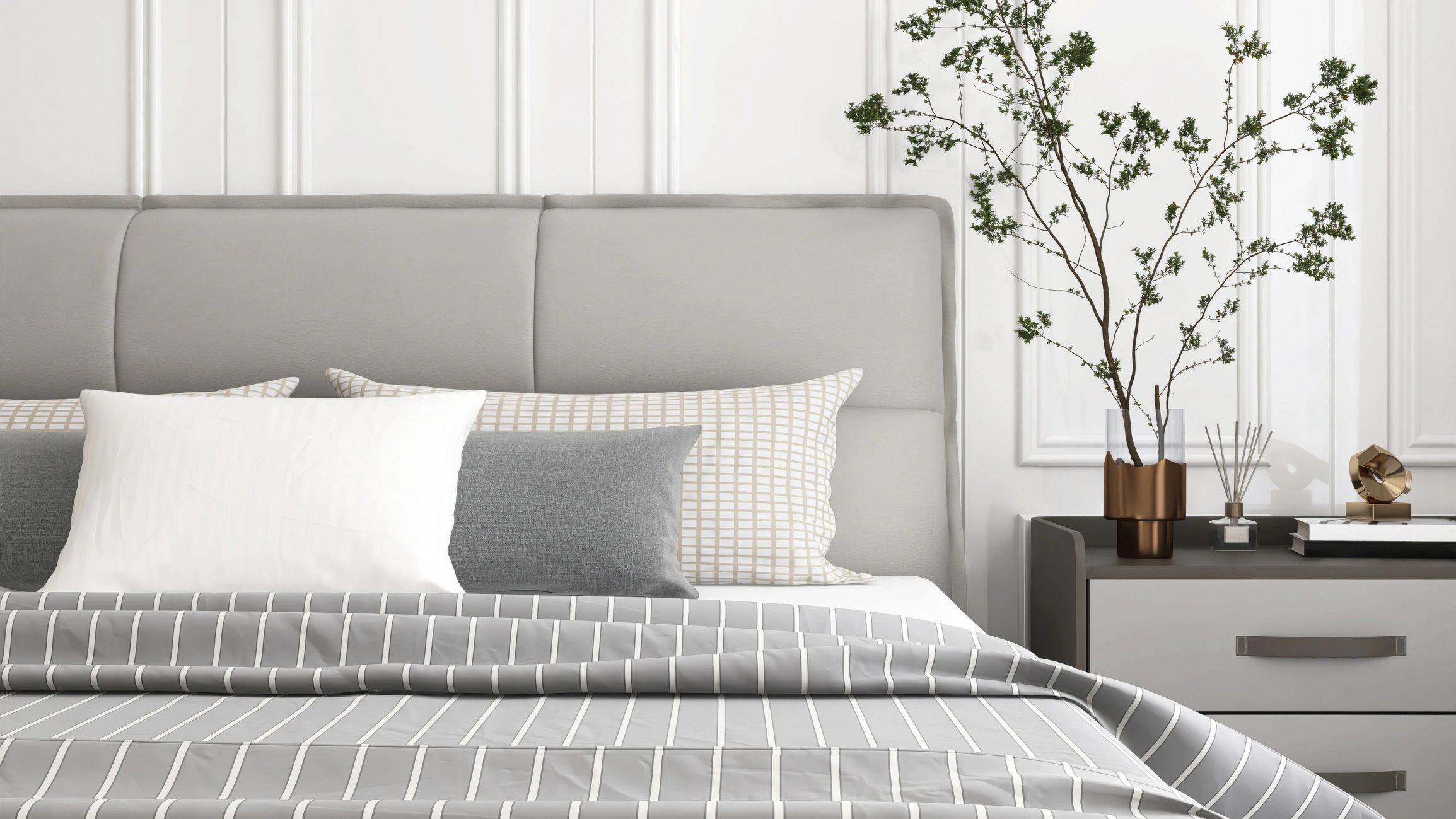 Textured bed with pillows and blanket