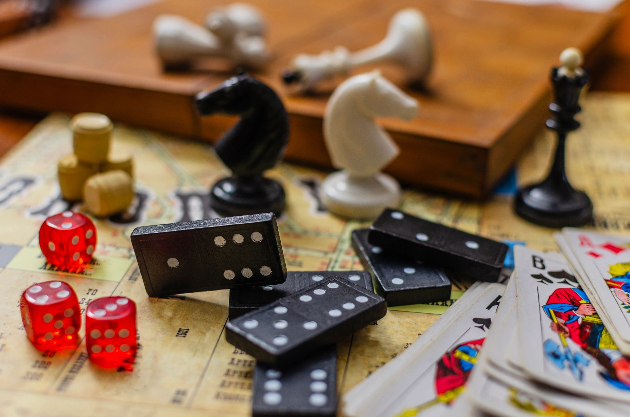 Classic tabletop game pieces arranged on a vintage map