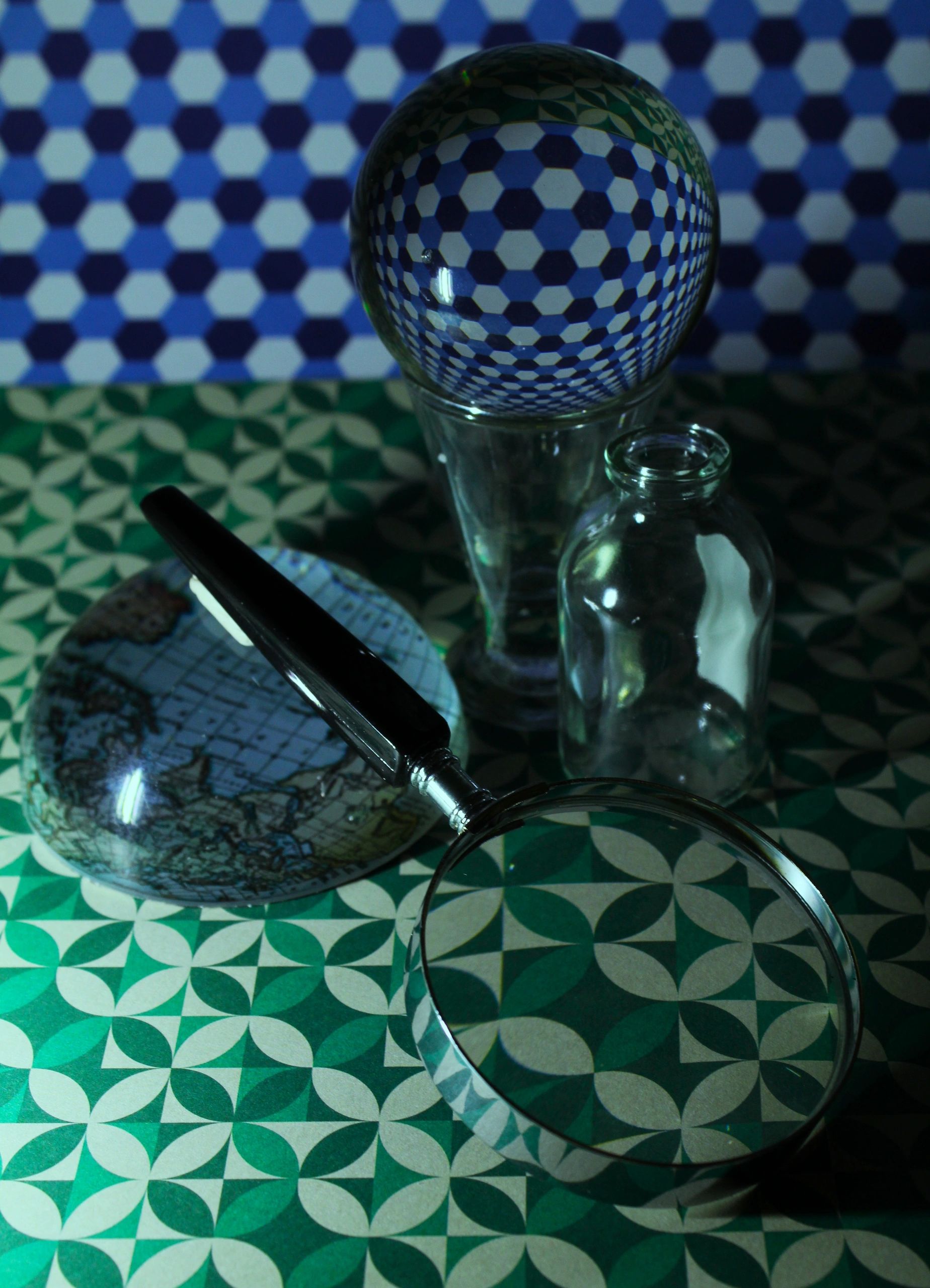 Editorial still life of glass and spoon with colored light