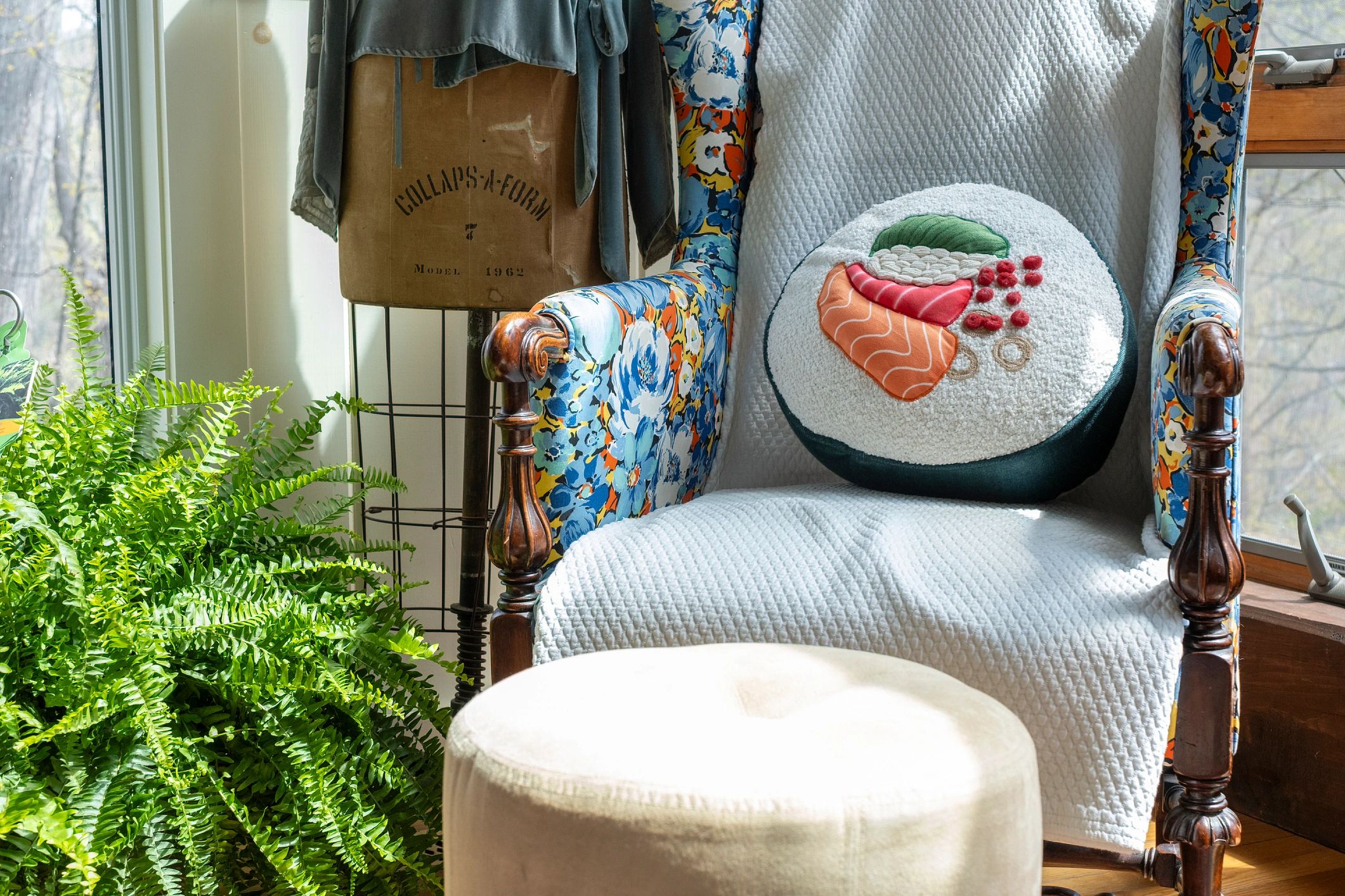 Quilted throw draped over a floral armchair