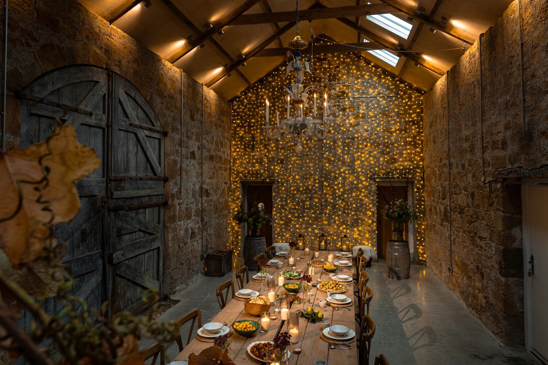 Editorial table setting with ceramics, food, and candles