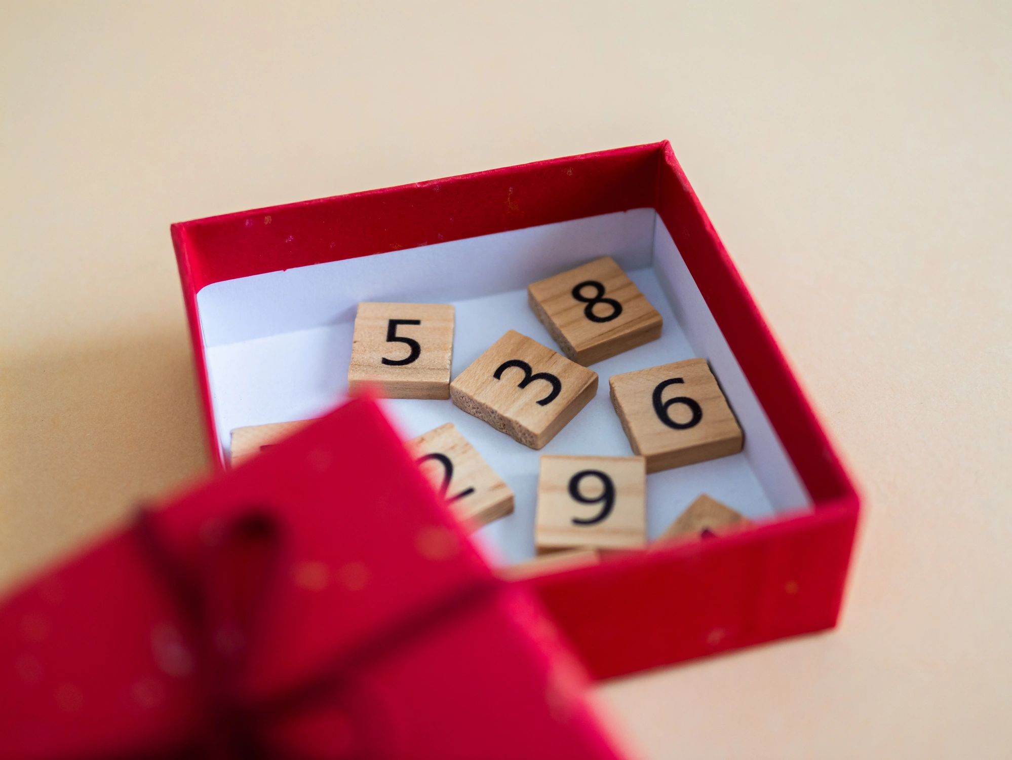Red gift box with wooden tiles