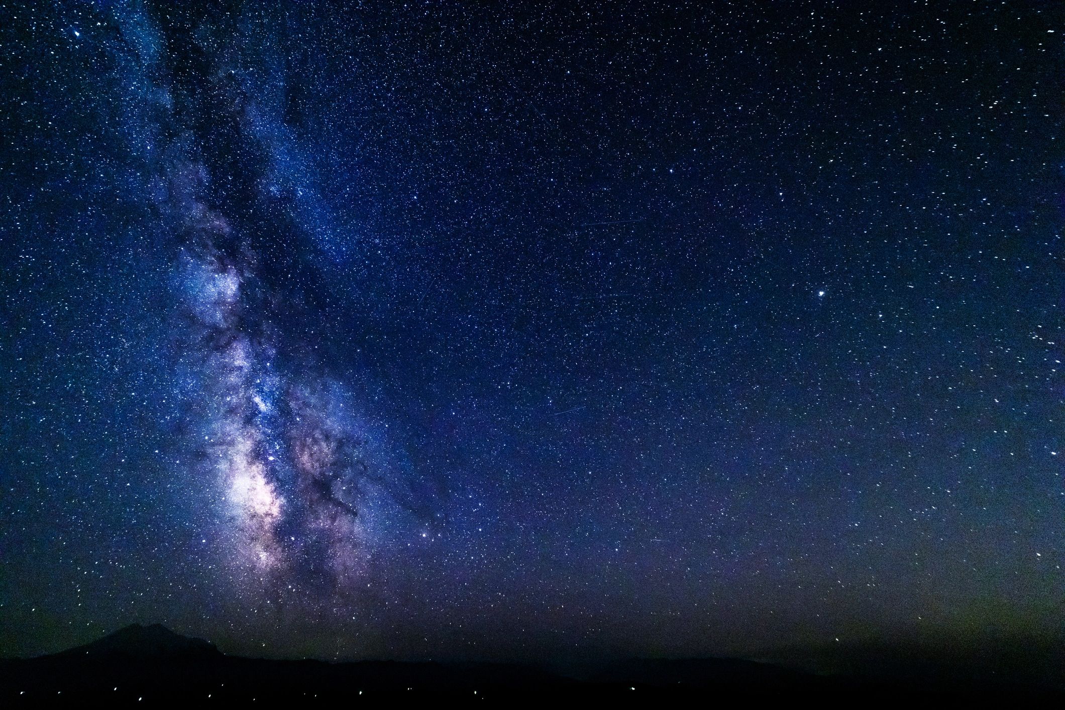 Milky Way galaxy across a deep blue star-filled night sky