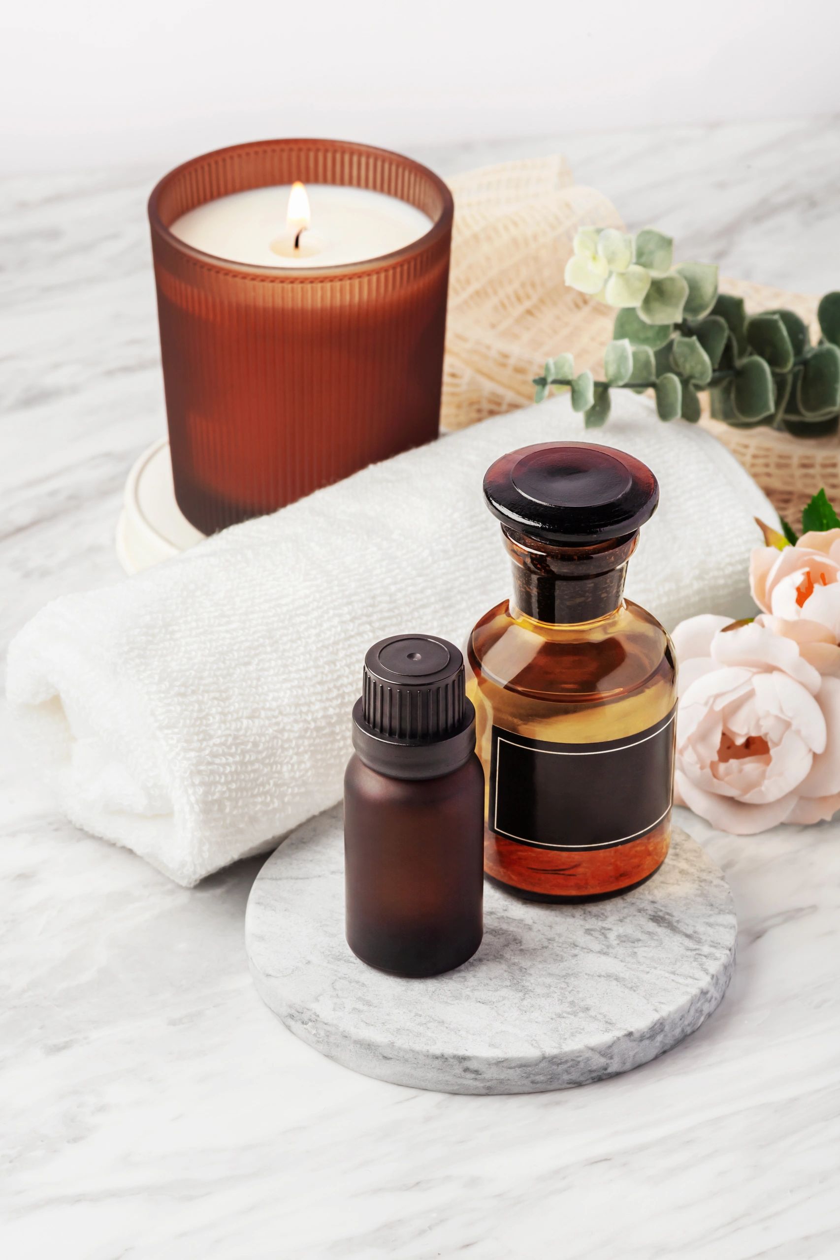 Spa-inspired beauty products on a marble surface