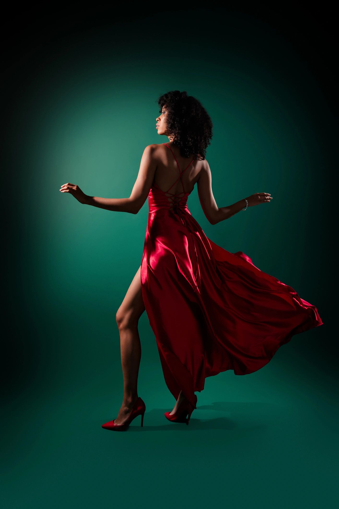 Woman in a flowing dress captured in graceful motion